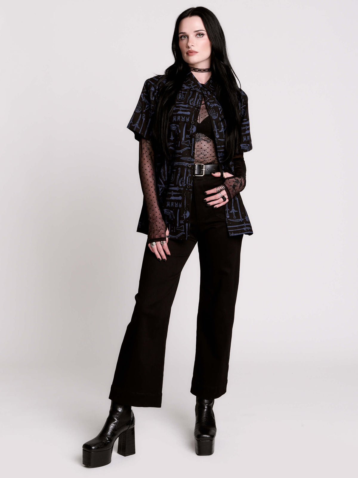 short-sleeve button-down that mixes crisp classic shirting with dark, gothic illustration.