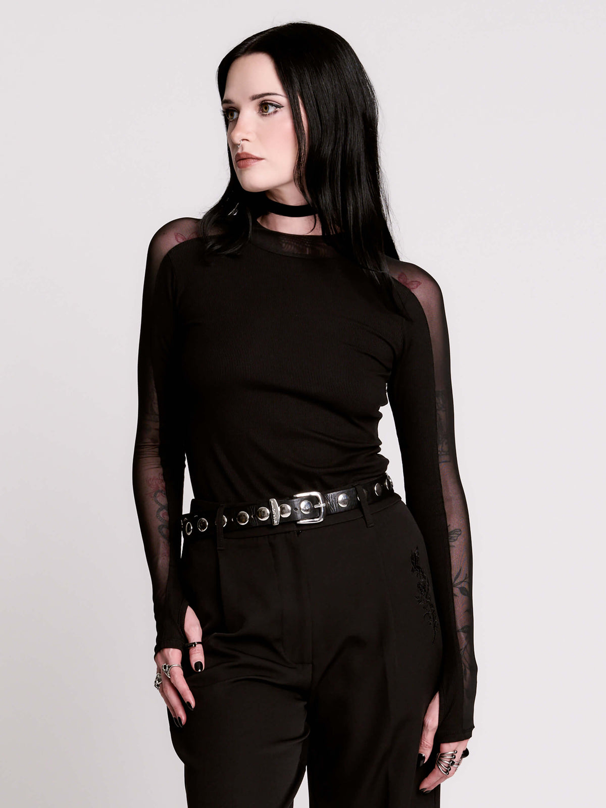 black long-sleeve top with sheer mesh sleeves