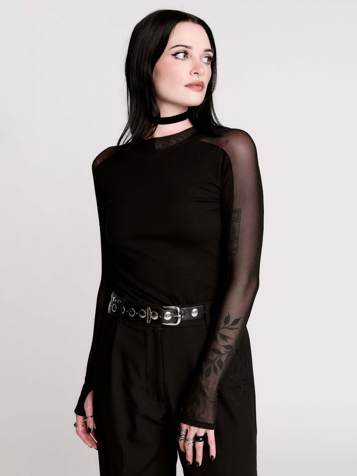 black long-sleeve top with sheer mesh sleeves