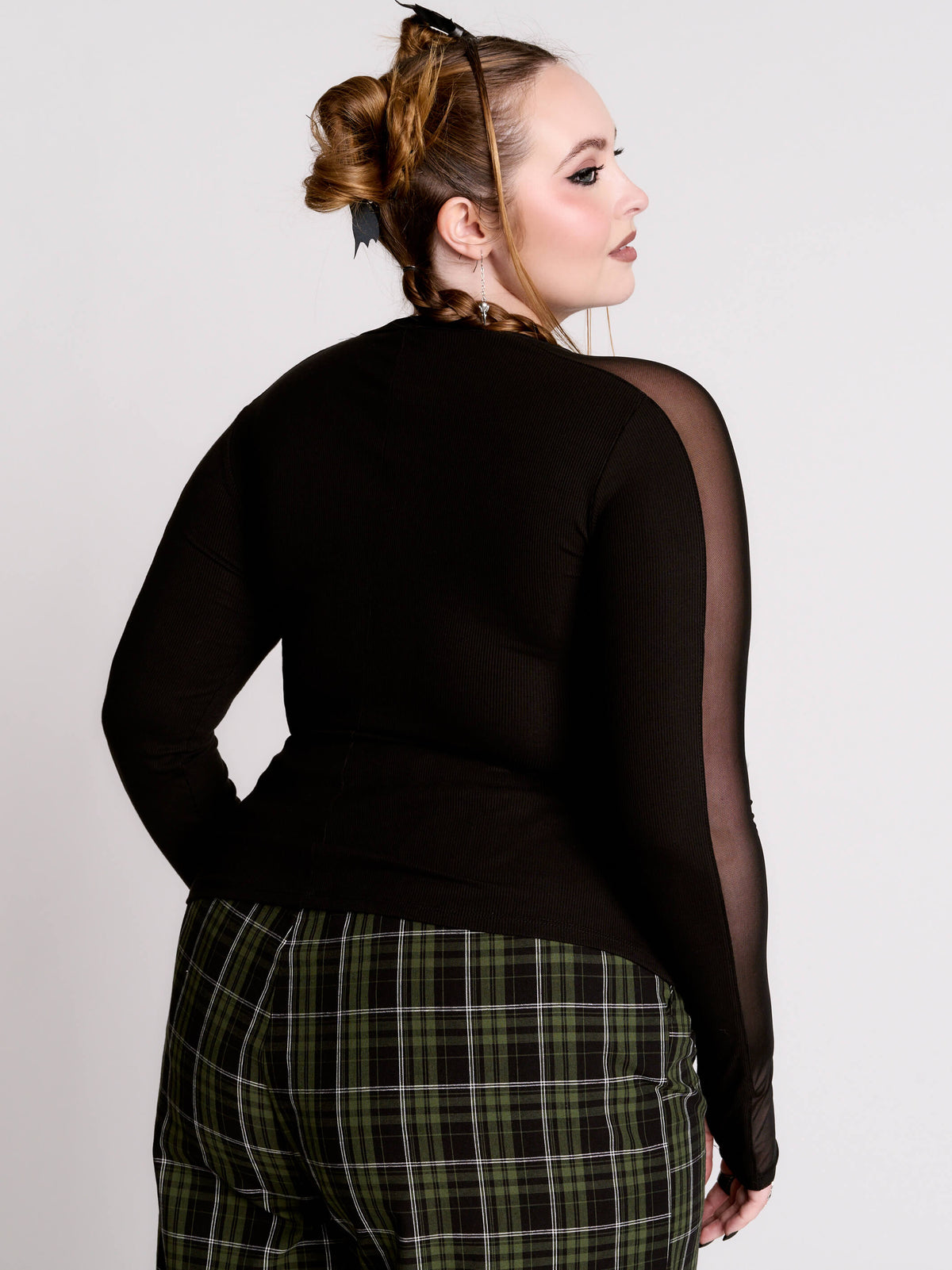 black long-sleeve top with sheer mesh sleeves
