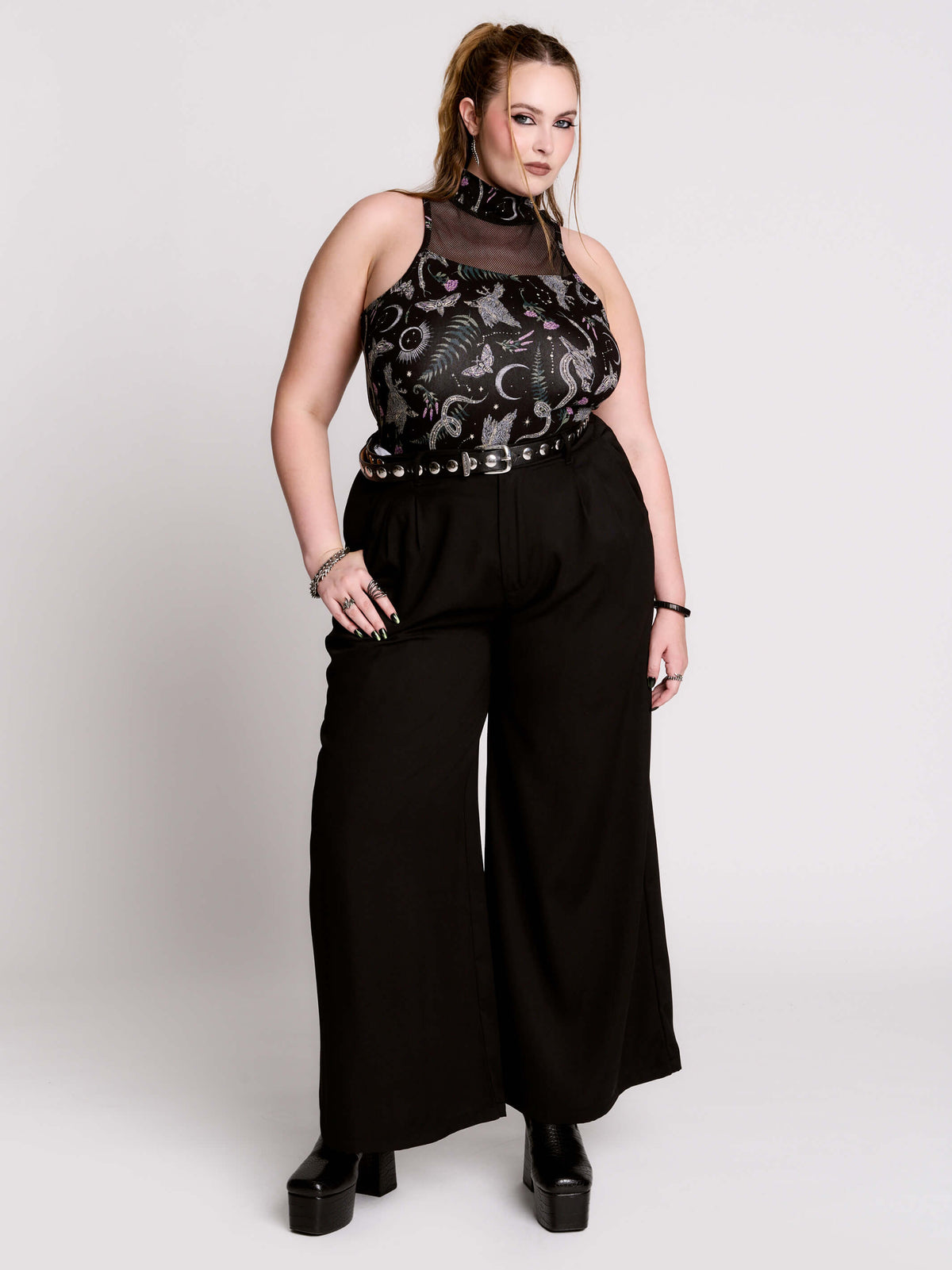 A black sleeveless top with a high mesh neck and an allover gothic-style print featuring silver snakes, moths, ravens and small pink floral accents.