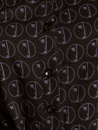 Close-up of a shirt with a geometric pattern on a black background