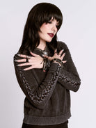 distressed braided sweater