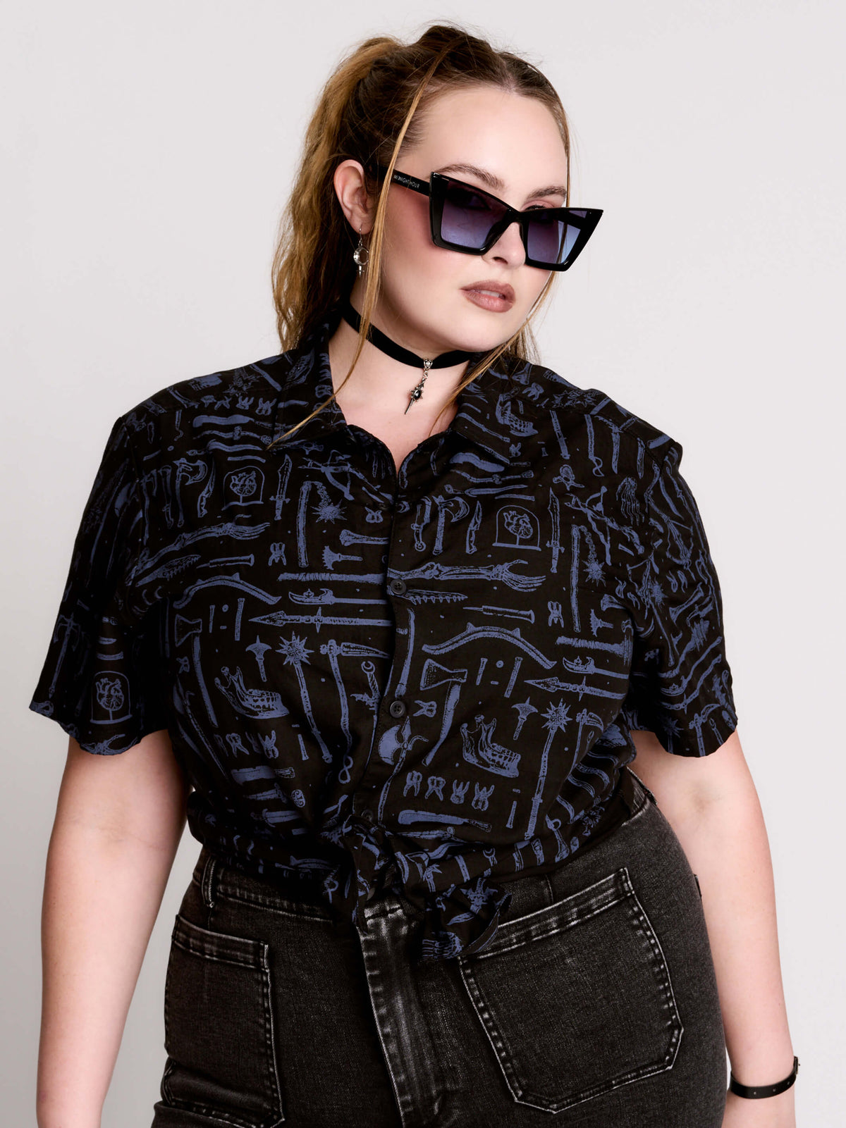 short-sleeve button-down that mixes crisp classic shirting with dark, gothic illustration. 