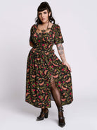 Woman wearing a floral dress with a white background