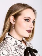 Pierced snake earring