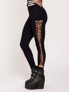 Stretchy cotton spandex leggings with slashed and braided side details. 