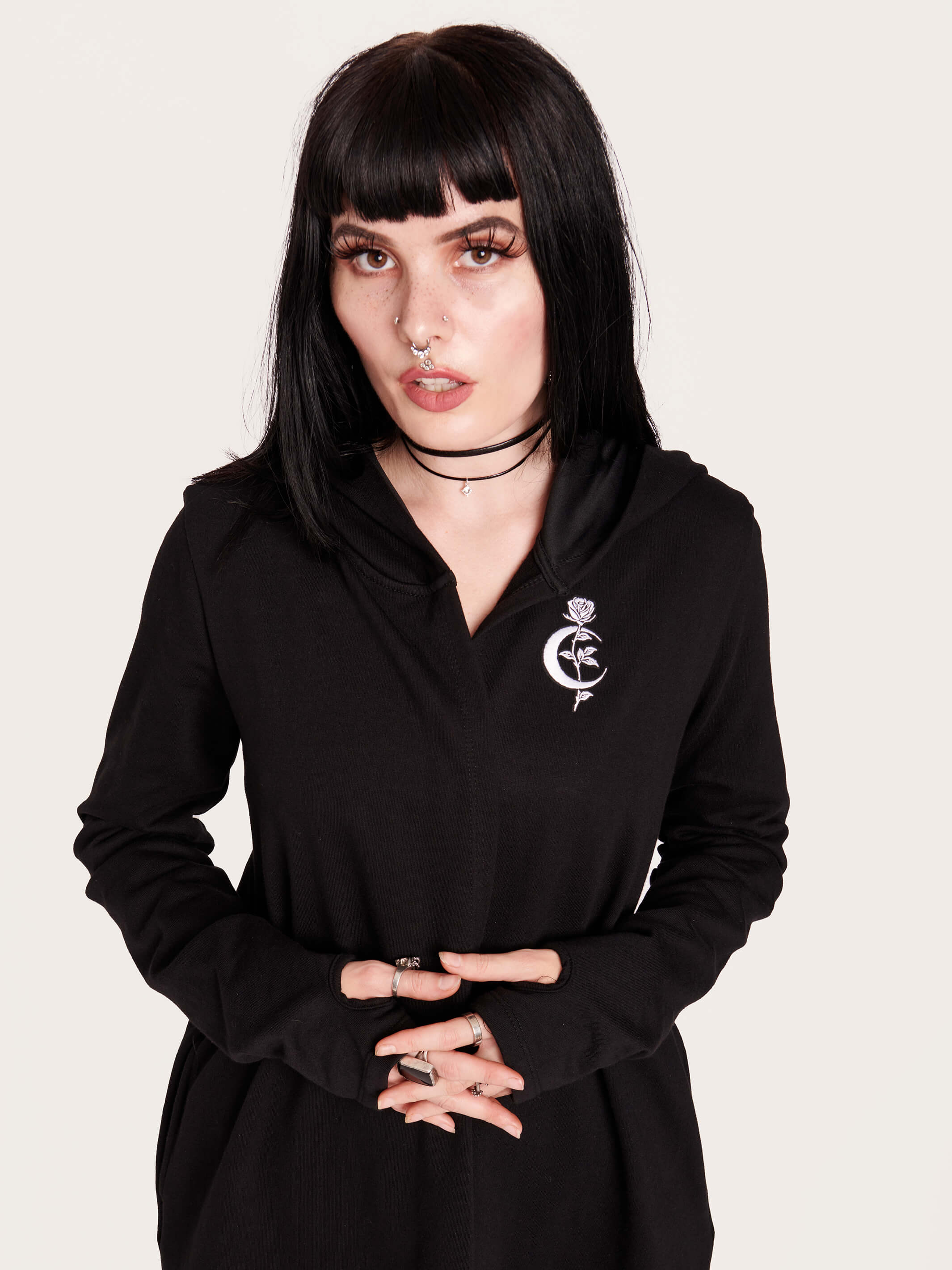 Tap into some voodoo vibes with this embroidered spinal back detail on our french terry hooded cloak. Crescent moon & rose embroidery on the front. Assymetrical hem with pockets. Goth grunge fashion, alt girl fashion, goth clothing, summer goth, skull top, goth punk top, egirl fashion, emo fashion.