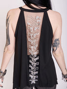 black tank with sheer back panel embroidered with spine motif